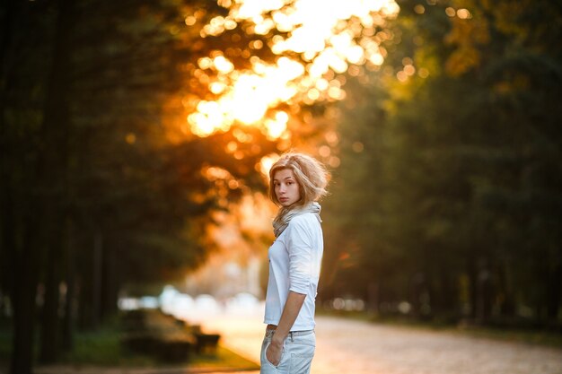Young woman posing at sunset
