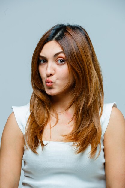 Young woman pouting lips