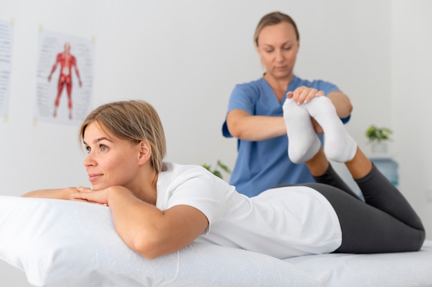 Young woman practicing an exercise in a physiotherapy session