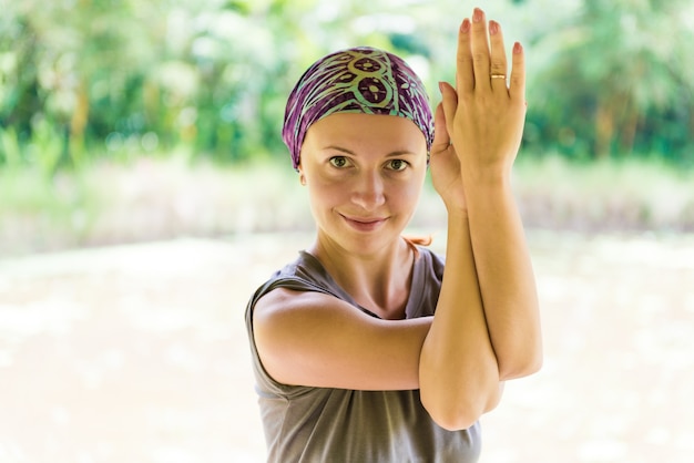 Young woman practicing garudasana