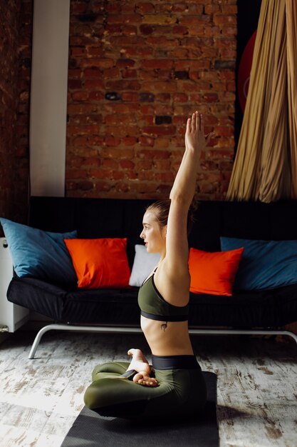 Young woman practicing yoga and fly yoga concept