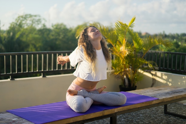 Young woman practicing yoga