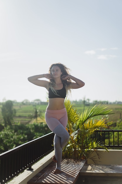 Free photo young woman practicing yoga