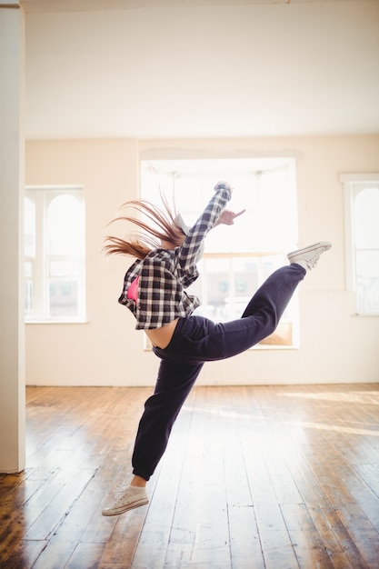 Free photo young woman practising hip hop dance