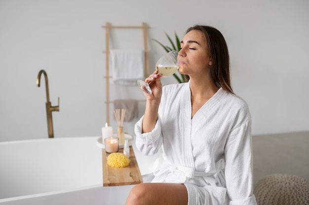 Young woman preparing for her bath time