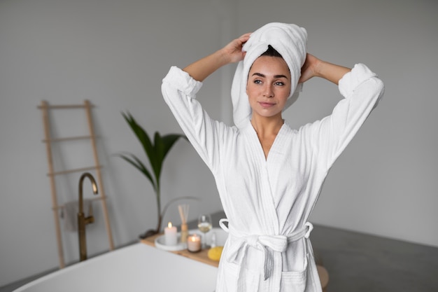 Free photo young woman preparing for her bath time