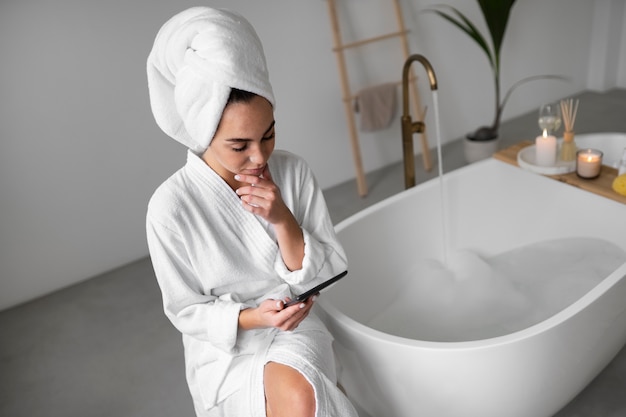 Young woman preparing for her bath time