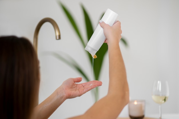 Young woman preparing for her bath time