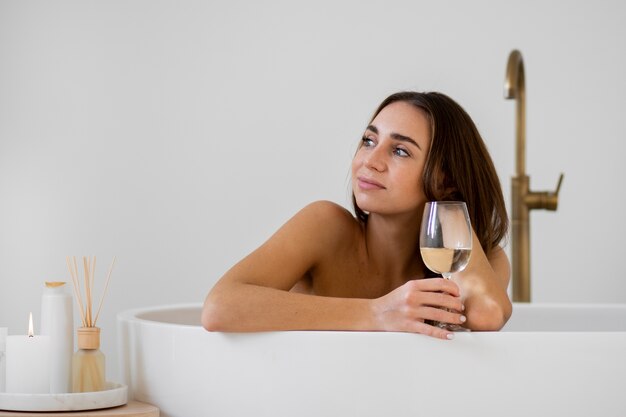 Young woman preparing for her bath time