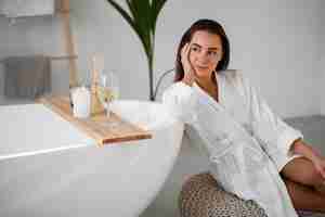 Free photo young woman preparing for her bath time