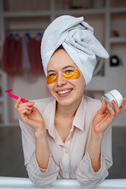 Young woman preparing for shaving her legs