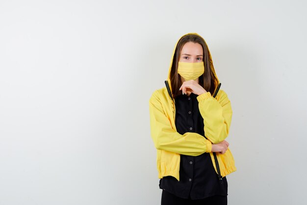 Young woman propping chin on hand