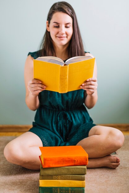 Young woman reading old book