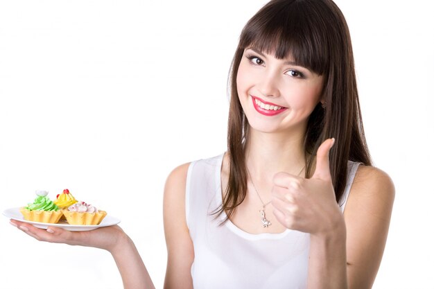 Young woman recommending cakes