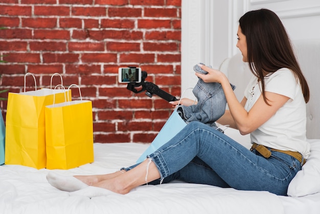 Young woman recording for her vlog