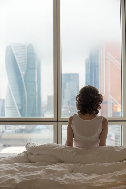 Young woman relaxing after waking up