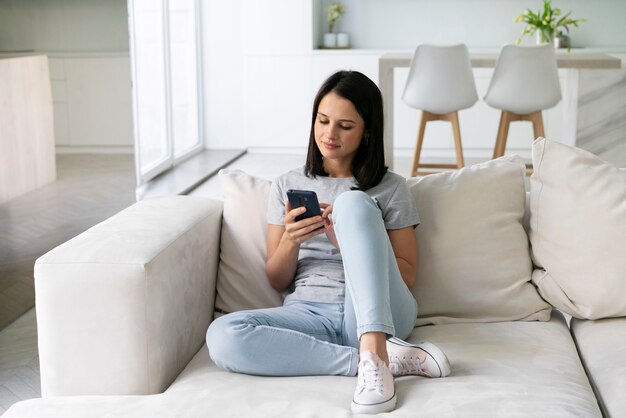 Young woman relaxing alone at home