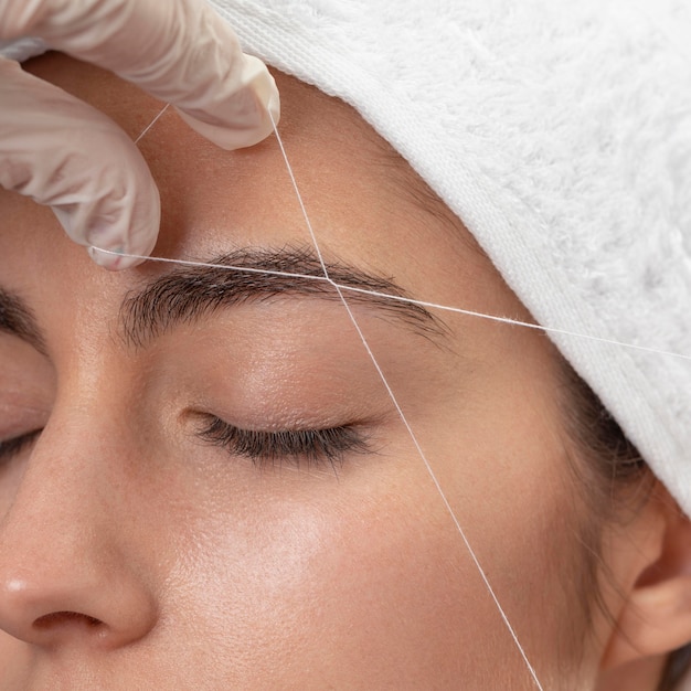 Free photo young woman relaxing at a beauty salon