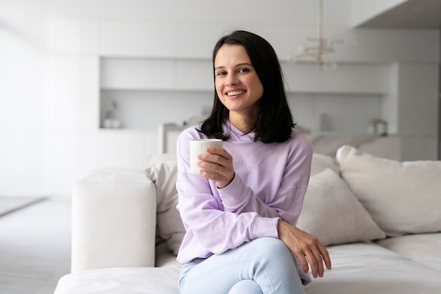 Young woman relaxing at home alone