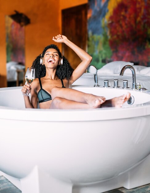 Young woman relaxing in the hydro massage bath