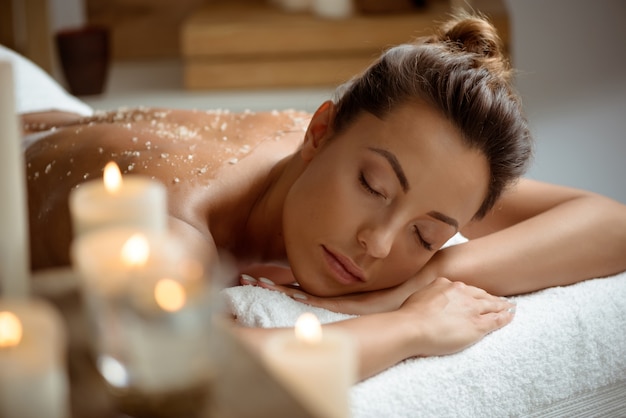 Young woman relaxing in spa salon.