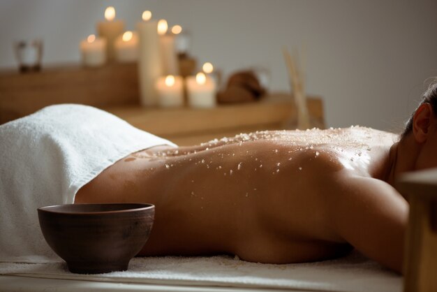 Young woman relaxing in spa salon.