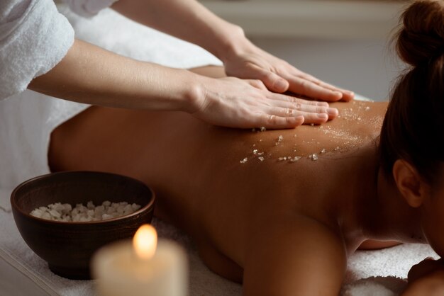 Young woman relaxing in spa salon.