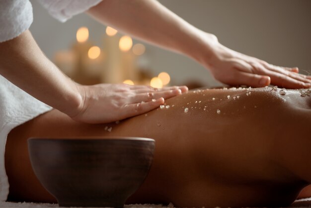 Young woman relaxing in spa salon.