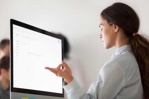 Free photo young woman relaxing taking break from computer work for meditation