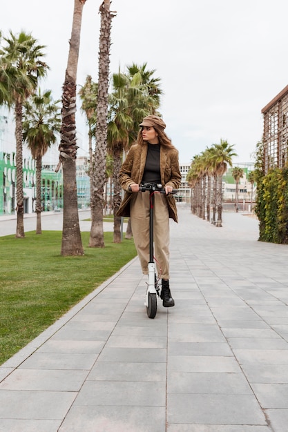 Young woman riding an electric scooter