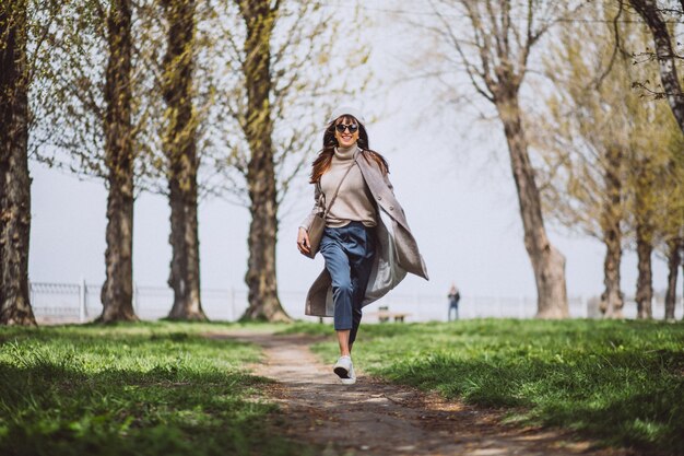 Young woman running in park