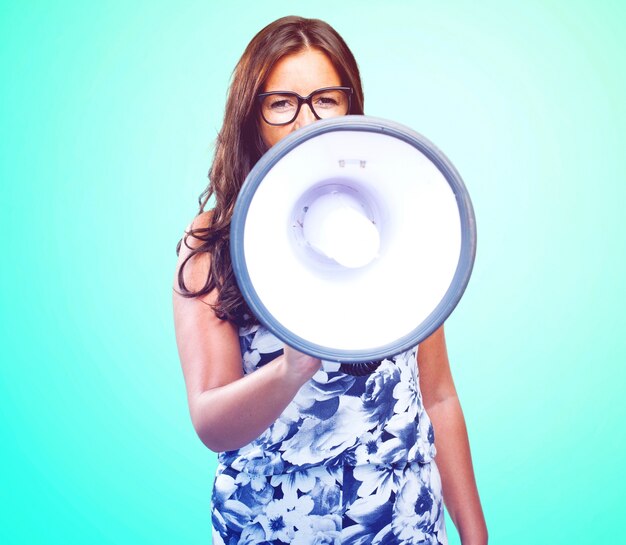 young woman shouting with megaphone