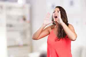 Free photo young woman shouting