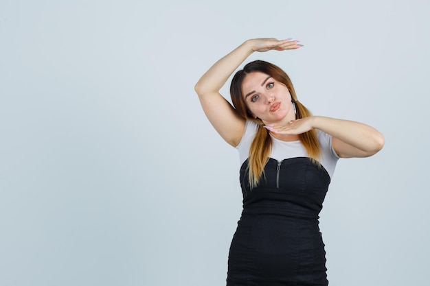 Young woman showing dance gesture