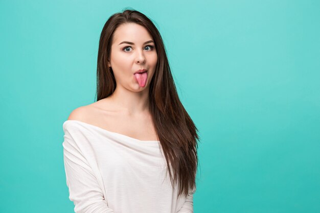 young woman showing her tongue