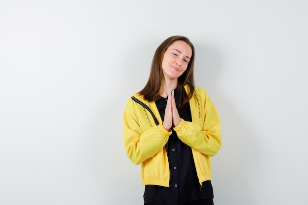 Young woman showing namaste gesture