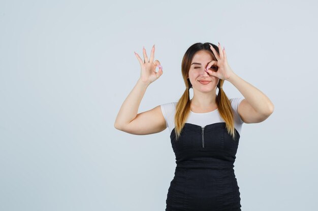 Young woman showing ok gesture