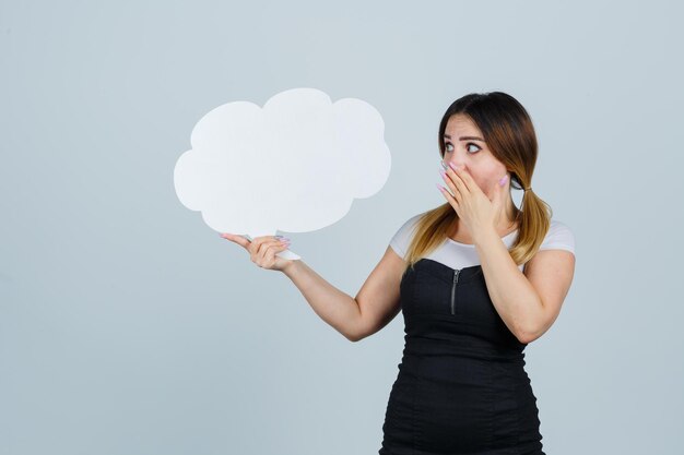 Young woman showing speech bubble