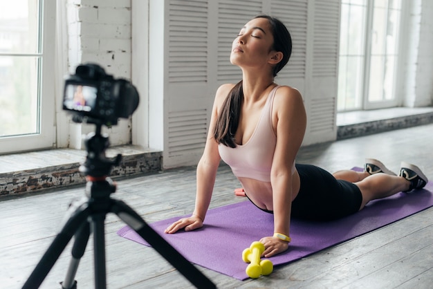 Free photo young woman showing sports exercises