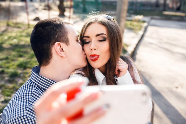 Young woman showing the tongue before taking the photo