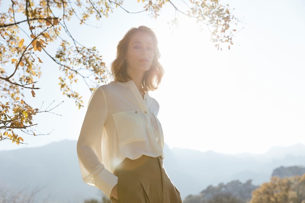 Young woman silhouette under sunlight