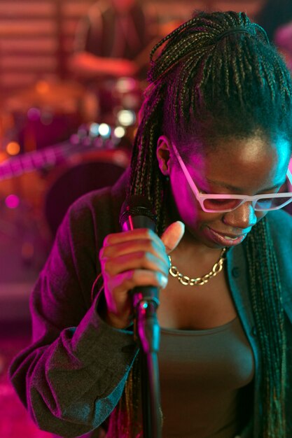 Young woman singing at a local event