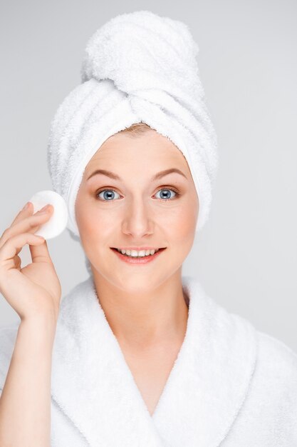 Young woman do skincare routine in shower