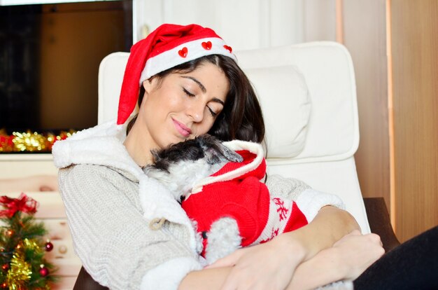 Young woman sleeping with her dog