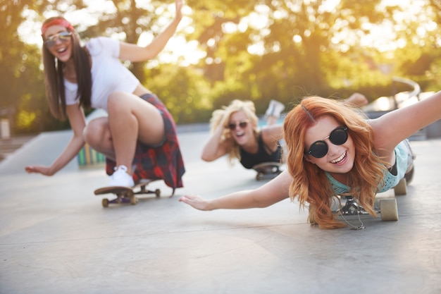 Young woman spending time together in skatepark