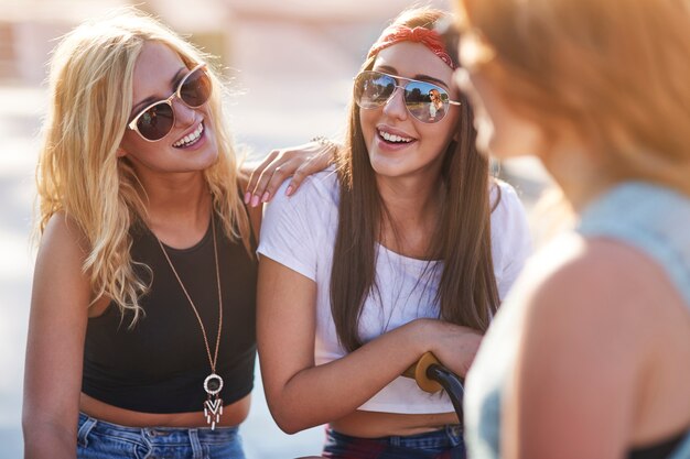 Young woman spending time together in skatepark