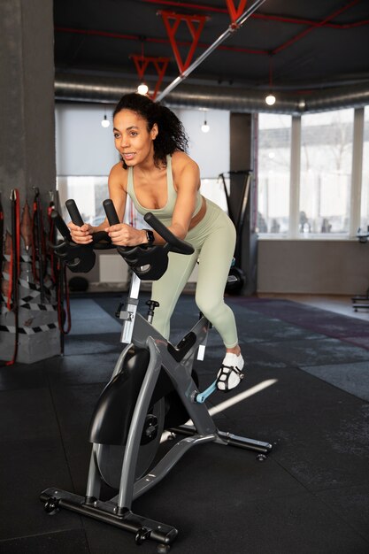 Young woman in spinning class