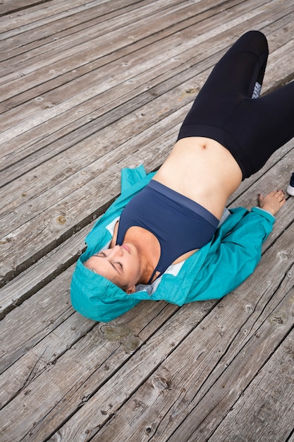 Young woman in sportswear outside