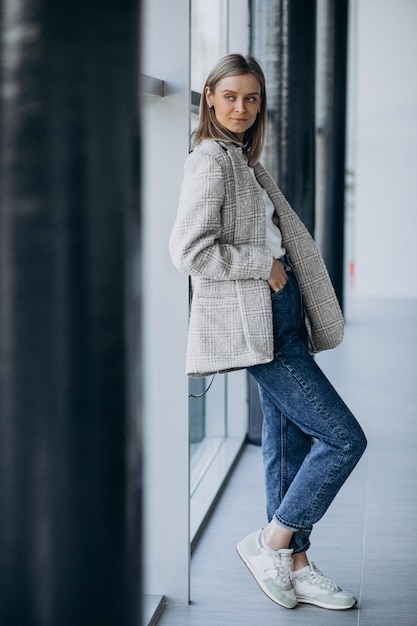 Young woman standing inside the office center