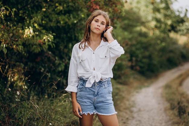 Young woman standing in park